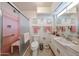 Bathroom featuring glass enclosed shower, decorative tile, and built-in vanity at 10846 N Fairway E Ct, Sun City, AZ 85351