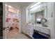 Bathroom featuring vanity area, tile floor, and adjacent toilet area at 10846 N Fairway E Ct, Sun City, AZ 85351