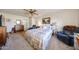 Main bedroom showcases carpeted floors, ceiling fan, and seating area at 10846 N Fairway E Ct, Sun City, AZ 85351