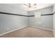 Bedroom featuring a neutral color scheme, plush carpet, and a bright window at 11128 E Segura Ave, Mesa, AZ 85212