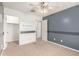 Bedroom with a two-tone color scheme and a walk-in closet at 11128 E Segura Ave, Mesa, AZ 85212