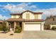 Two story home featuring a front yard, neutral color scheme, and a two-car garage at 11128 E Segura Ave, Mesa, AZ 85212