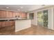 Well-lit kitchen with stainless steel microwave, granite countertops, cabinets and tile floors at 11128 E Segura Ave, Mesa, AZ 85212