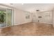 Spacious living room featuring tile flooring, natural light, and patio access at 11128 E Segura Ave, Mesa, AZ 85212