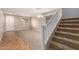 Inviting living room with carpet flooring, natural light, staircase and tile entry at 11128 E Segura Ave, Mesa, AZ 85212