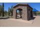 Stone open air building in a park with landscaping and a blue sunshade in the background at 11128 E Segura Ave, Mesa, AZ 85212