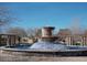 Beautiful multi-tiered water fountain feature surrounded by trees and pergola structures at 11128 E Segura Ave, Mesa, AZ 85212