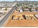 A new construction of the house, an aerial view of the neighborhood in the distance at 11206 E Crescent Ave, Mesa, AZ 85208