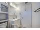 Bright bathroom features a clean white vanity, mirrored cabinet, and assistive safety features at 11407 N 111Th Ave, Sun City, AZ 85351