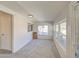 Sunroom featuring carpet floors, windows, and outdoor access at 11407 N 111Th Ave, Sun City, AZ 85351