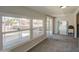 Light-filled sunroom with large windows offering views of the surrounding area at 11407 N 111Th Ave, Sun City, AZ 85351