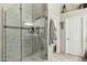 Modern bathroom featuring a glass-enclosed shower, neutral tile, and a functional layout with ample space at 12610 E Cortez Dr, Scottsdale, AZ 85259