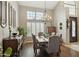 Formal dining room with a grand chandelier, hardwood floors, and elegant decor at 12610 E Cortez Dr, Scottsdale, AZ 85259