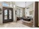 Grand entryway featuring a detailed front door, tile flooring, and a view into the living room at 12610 E Cortez Dr, Scottsdale, AZ 85259