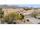 Charming exterior elevation with tile roof, a three-car garage, and manicured desert landscaping at 12610 E Cortez Dr, Scottsdale, AZ 85259