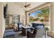 Inviting covered patio with wicker furniture, ceiling fan, and lovely outdoor seating area at 12610 E Cortez Dr, Scottsdale, AZ 85259