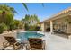 Inviting backyard pool area with lounge chairs, manicured landscaping, and covered patio for relaxation at 12610 E Cortez Dr, Scottsdale, AZ 85259