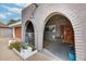 Close up shot of the arched entryway with a detailed double front door at 13845 N 41St Ave, Phoenix, AZ 85053