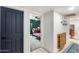 Hallway leading to a bedroom featuring carpeted floors and stylish design at 13845 N 41St Ave, Phoenix, AZ 85053