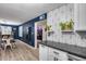 Contemporary eat-in kitchen features stainless steel appliances and geometric backsplash at 13845 N 41St Ave, Phoenix, AZ 85053