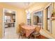 Bright dining area with bay windows, a breakfast nook, and easy access to the kitchen, perfect for casual dining at 14718 W Ravenswood Dr, Sun City West, AZ 85375