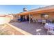 Covered patio with ample seating and outdoor dining, perfect for entertaining or relaxing in the shade at 14718 W Ravenswood Dr, Sun City West, AZ 85375