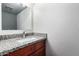 Bathroom vanity with granite counters, a rectangular mirror, and a silver faucet at 1578 W Campbell Ave, Phoenix, AZ 85015