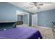 Comfortable bedroom with sliding door closet and blue accent wall at 1578 W Campbell Ave, Phoenix, AZ 85015