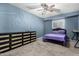 Cozy bedroom with carpet, painted blue walls, and a full-sized bed at 1578 W Campbell Ave, Phoenix, AZ 85015