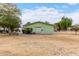 Well-maintained community building with a green exterior, landscaping, and ample space for gatherings at 1578 W Campbell Ave, Phoenix, AZ 85015