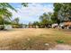 Wide view of community common area and various townhomes with mature landscaping on a sunny day at 1578 W Campbell Ave, Phoenix, AZ 85015