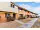 A row of quaint townhomes showcases a well-maintained exterior with brick and siding details at 1578 W Campbell Ave, Phoenix, AZ 85015