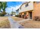 Charming townhome exterior with a walkway, showcasing its curb appeal and inviting entrance at 1578 W Campbell Ave, Phoenix, AZ 85015