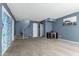 Inviting living area with staircase, storage, carpet flooring and a decorative sliding door at 1578 W Campbell Ave, Phoenix, AZ 85015