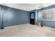 Cozy living room showcasing carpet floors, accent lighting, and a decorative custom door at 1578 W Campbell Ave, Phoenix, AZ 85015