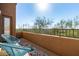 Open-air balcony with lounge seating offering panoramic views, perfect for relaxation and outdoor enjoyment at 16600 N Thompson Peak Pkwy # 1052, Scottsdale, AZ 85260