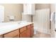 Well-lit bathroom featuring a sleek vanity, bright mirror, and shower with a neutral color palette at 16600 N Thompson Peak Pkwy # 1052, Scottsdale, AZ 85260