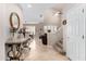 A lovely foyer with travertine floors, leading into the dining and living areas with a staircase at 16600 N Thompson Peak Pkwy # 1052, Scottsdale, AZ 85260