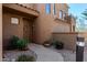 Inviting front entrance featuring a decorative door wreath and lush landscaping at 16600 N Thompson Peak Pkwy # 1052, Scottsdale, AZ 85260