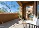 Inviting patio with plush seating, plants, and scenic views, blending outdoor space with residential charm at 16600 N Thompson Peak Pkwy # 1052, Scottsdale, AZ 85260