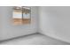 Bright bedroom features neutral carpet, white walls, and natural light from the window at 16778 W Yucatan Dr, Surprise, AZ 85378