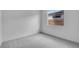 Neutral bedroom with carpeted floors and a view out the window at 16778 W Yucatan Dr, Surprise, AZ 85378