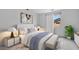 A well-lit bedroom with neutral colors, a comfortable bed, and a scenic window view at 16778 W Yucatan Dr, Surprise, AZ 85378