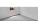 Empty bedroom with a view out the window and neutral-colored carpeting at 16778 W Yucatan Dr, Surprise, AZ 85378