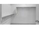 A neutral-colored walk-in closet with shelving and a clothes bar at 16778 W Yucatan Dr, Surprise, AZ 85378