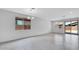 Living room featuring bright tile flooring and lots of natural light, with a backyard view at 16778 W Yucatan Dr, Surprise, AZ 85378