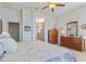 Primary bedroom featuring carpet and ensuite bathroom at 17634 W Verdin Rd, Goodyear, AZ 85338