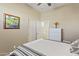 Cozy bedroom with a ceiling fan and a large window with plantation shutters at 17634 W Verdin Rd, Goodyear, AZ 85338