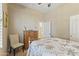 Bedroom offering a ceiling fan, dresser, and window with plantation shutters at 17634 W Verdin Rd, Goodyear, AZ 85338