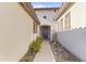 Inviting entryway with beautiful landscaping, a decorative door, and a charming walkway at 17634 W Verdin Rd, Goodyear, AZ 85338